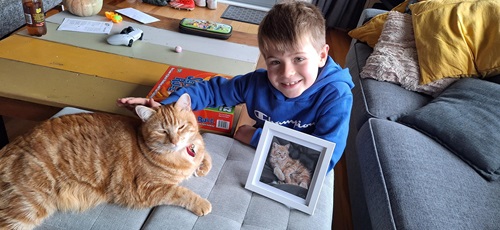 Animal Profile Competition - Overall Winner: Hector with his cat and drawing done by Bernadette Ballantyne!